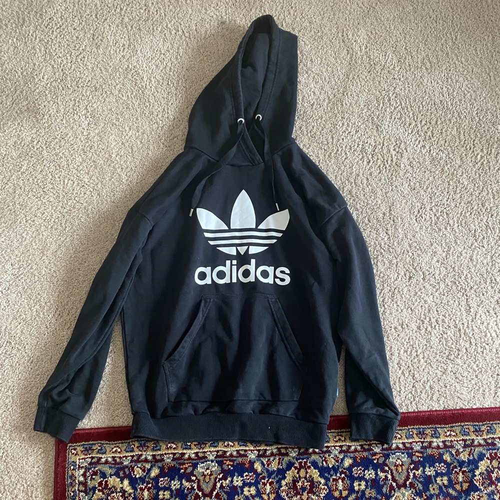 Adidas black hoodie with front pocket.